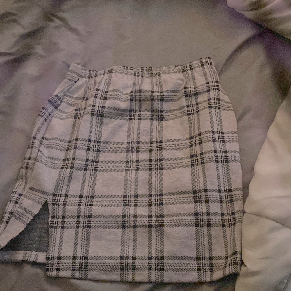 This is a pink skirt and on top a black plaid part!!